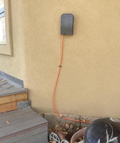 Photo of fiber connection on exterior of house.