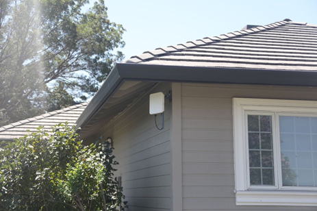 photo of wireless internet equipment on house exterior