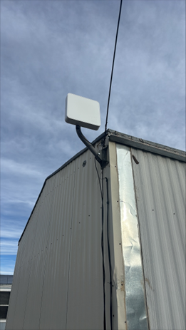 photo of wireless internet equipment on shed exterior