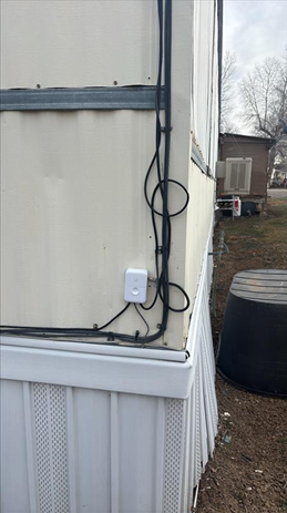 photo of wireless internet equipment on shed exterior